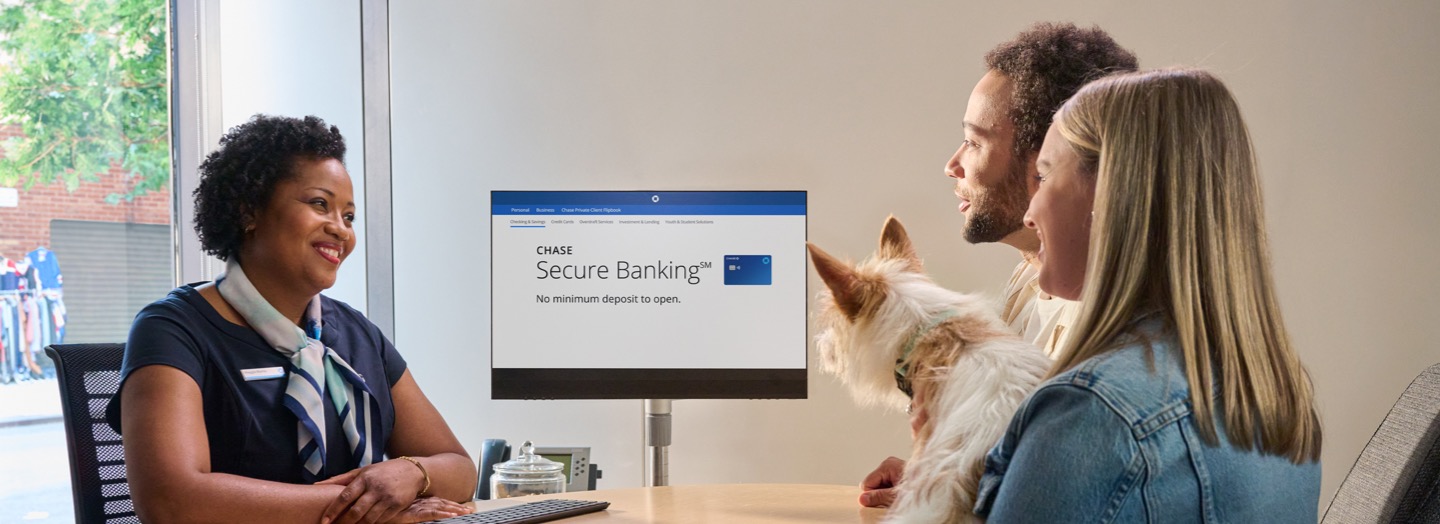 A couple speaks with a banker about Secure Banking at their local Chase branch