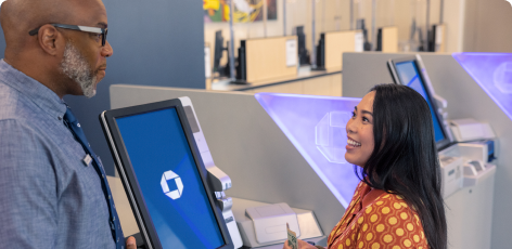 A Chase Premier Savings customer uses an ATM at their local branch