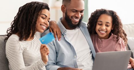 Parents help their child set up their account online
