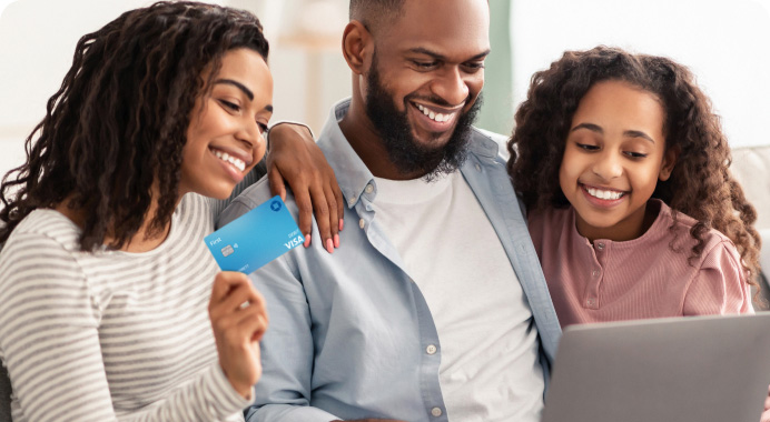 Parents help their child set up their account online